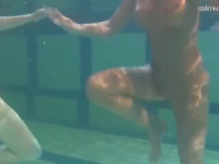 Extraordinary chicks irina and anna swim naked in the basseýn